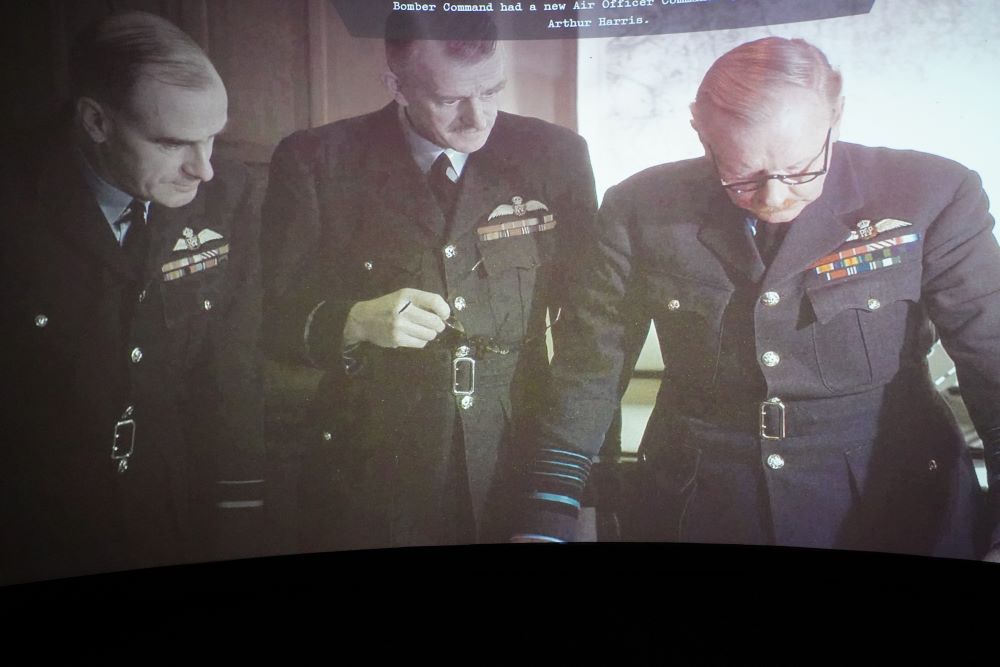 Sir Arthur “Bomber” Harris (right) on the big screen at the centre.